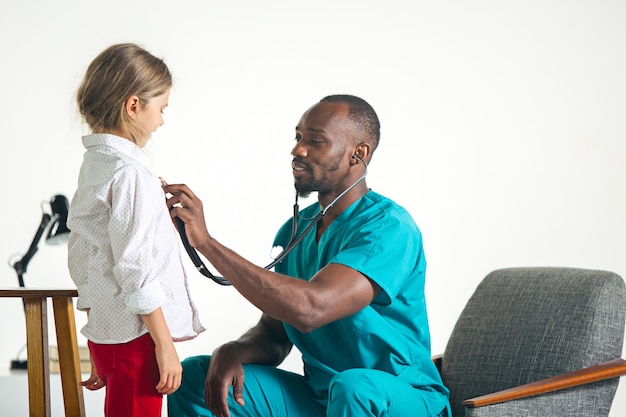 healthcare-medical-concept-doctor-with-stethoscope-listening-child-chest-hospital_155003-7484